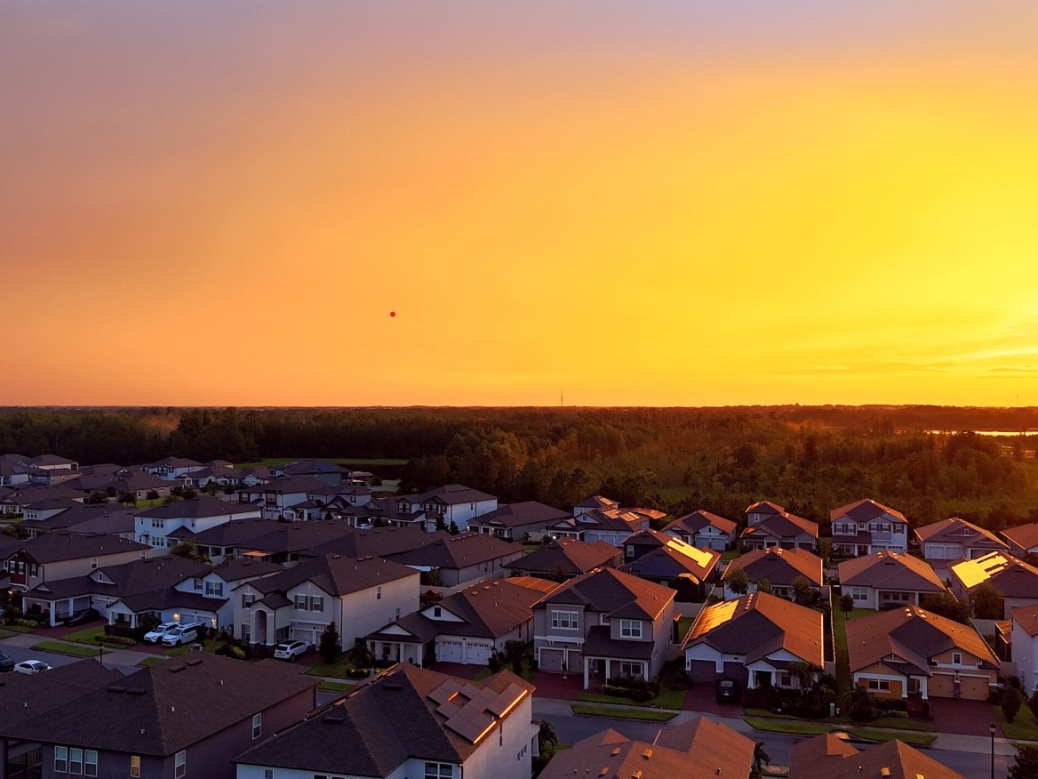 Aerial view of new construction homes at sunset in Horizon West, Florida