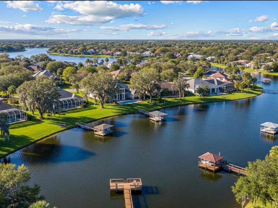 Aerial view of lakefront homes and boat docks in Windermere, Florida